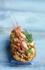 Crostino with shrimps and bottarga — Stock Photo