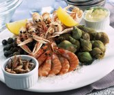 Closeup view of platter with different seafood and fruit — Stock Photo
