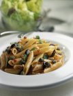 Penne pasta with capers — Stock Photo