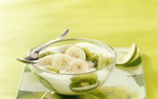 Closeup view of ginger flavored fruit soup with banana and kiwi — Stock Photo