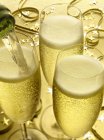 Champagne glasses on festive table — Stock Photo