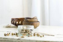 Pistachios in glass jar — Stock Photo