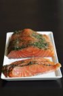 Raw salmon with dill — Stock Photo