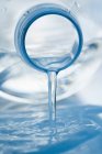 Closeup view of water flowing from a plastic bottle — Stock Photo