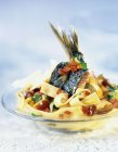 Tagliatelle pasta with fish and beans — Stock Photo