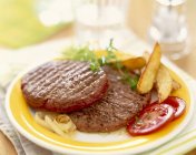 Hamburgers with French fries — Stock Photo