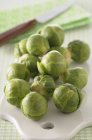 Brussels sprouts on desk — Stock Photo