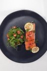 Salmon poached in olive oil — Stock Photo