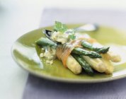 Bundle of asparagus with smoked salmon — Stock Photo
