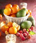 Fruit compostion in basket over textile surface — Stock Photo