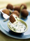 Portion of falafel serving with dip — Stock Photo