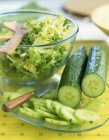 Cucumber and frizzy lettuce — Stock Photo