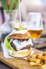 Cream cheeseburger and french fries — Stock Photo