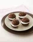 Closeup view of whoopie pies on plates — Stock Photo