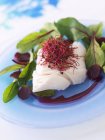 Piece of cod with beetroot — Stock Photo