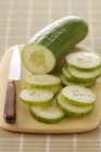 Fresh partly Sliced cucumber — Stock Photo