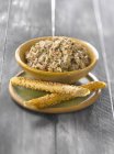 Sardine and chive pat in small bowl — Stock Photo