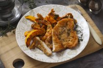 Veal with pumpkin on plate — Stock Photo