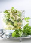 Chilled diced cod and cucumber with coriander in glass — Stock Photo