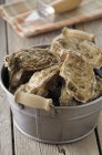 Bucket of fresh oysters — Stock Photo
