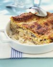 Cut seafood lasagne with cheese — Stock Photo