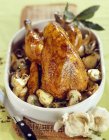 Guinea-fowl with ceps — Stock Photo