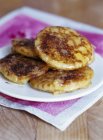 Closeup view of French blinis heap on white plate — Stock Photo
