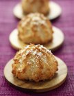 Closeup view of coconut Rochers on wooden plates — Stock Photo