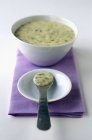 Closeup view of Bearnaise sauce on a spoon and in a bowl — Stock Photo