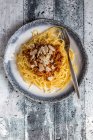 Spaghetti with vegetarian bolognese and shaved Parmesan — Stock Photo