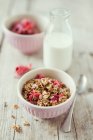 Homemade crunchy muesli with candied hibiscus flowers and grain milk — Stock Photo