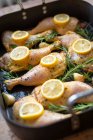 Chicken legs with lemons and rosemary — Stock Photo