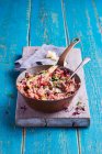 Creamy vegetable risotto with beetroot, butternut squash and topped with micro herbs and grated parmesan — Stock Photo