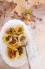 Grilled fennel salad with olives anchovies orange juice and oregano — Stock Photo