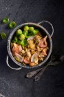 Pasta with pink oyster mushrooms, pistachios and brussels sprouts — Stock Photo