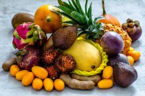 Exotic fruits on a concrete background — Stock Photo