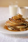 Ricotta Pancakes with Hot Banana Syrup — Stock Photo