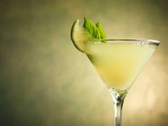 Gin Rickey cocktail with basil and lime — Stock Photo