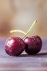 Two wet cherries, close up — Stock Photo