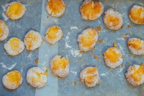 Freshly baked scones on baking paper — Stock Photo