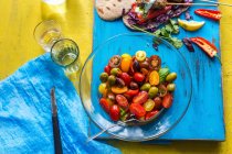 A tomato salad with olives and basil — Stock Photo