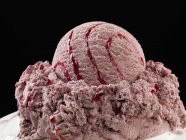 Raspberry ice cream with raspberry sauce — Stock Photo