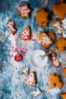 Christmas cookies making process with glaze and sprinkles — Stock Photo