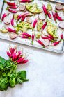 Roasted radishes and cauliflower on baking tray — Stock Photo
