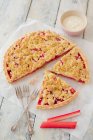 Vegan rhubarb tart with crumbles and vanilla cream — Stock Photo