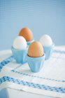 Four eggs in eggcups — Stock Photo