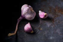 Garlic on a black background — Stock Photo