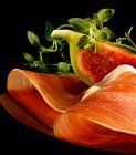 Parma ham and a fresh fig — Stock Photo