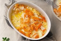 Baked pumpkin in a creamy cheese sauce — Stock Photo