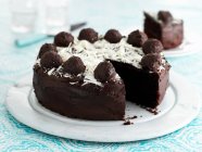 Chocolate truffle cake, sliced — Stock Photo